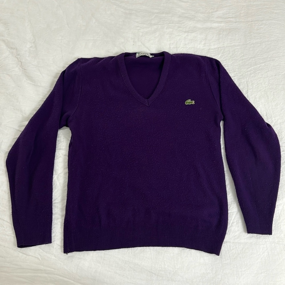Lacoste v neck sweater. No holes or stains. Listed as a medium but more small